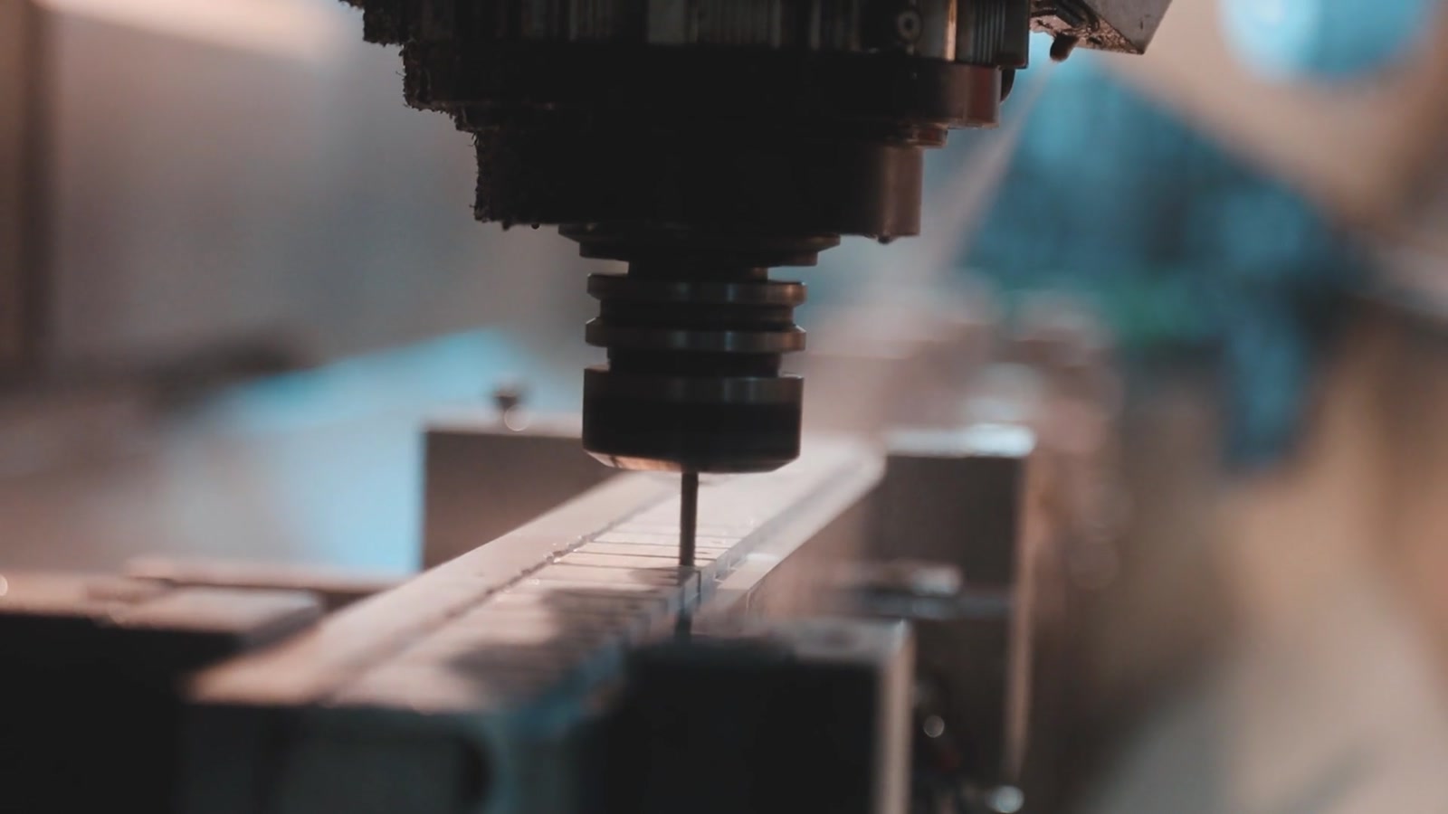 CNC cutter machining a precisely clamped metal workpiece.